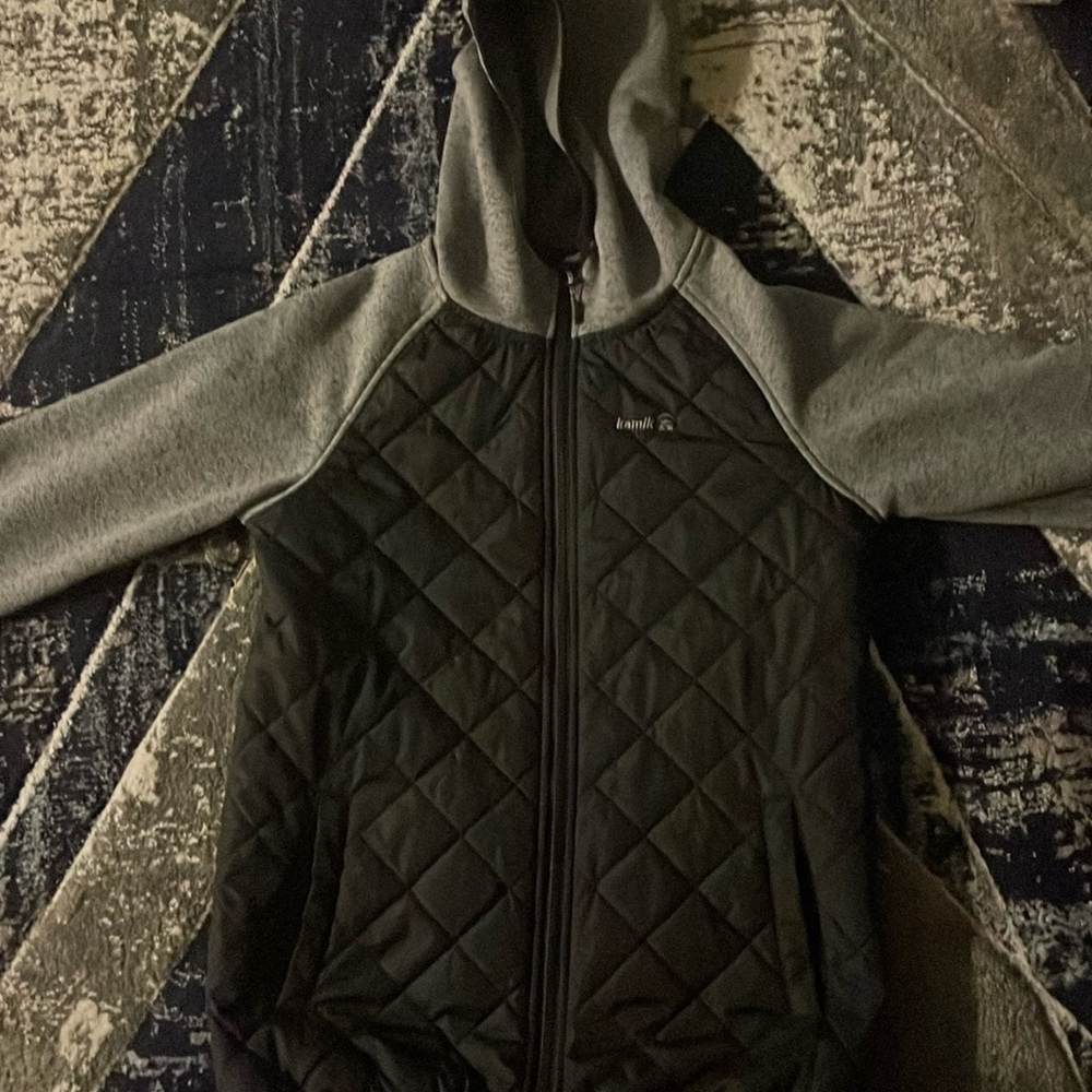 Too small, rain/snow jacket brand kamik color black and grey size large kids